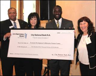 City National Bank has fortified the EDC-VC Loan Fund with $250,000 to help local businesses. Greg Glover, from left, senior vice president and regional manager for City National Bank; Sim Tang-Paradis, vice president & branch manager, City National Bank; EDC-VC loan officer Marvin Boateng; 2015 EDC-VC board chair Roseann Mikos. Courtesy photo.