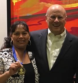 PSHH resident Elvia Salazar and NW President Paul Weech. Salazar is a winner of the NeighborWorks America 2016 Dorothy Richardson Award for Resident Leadership. Courtesy photo